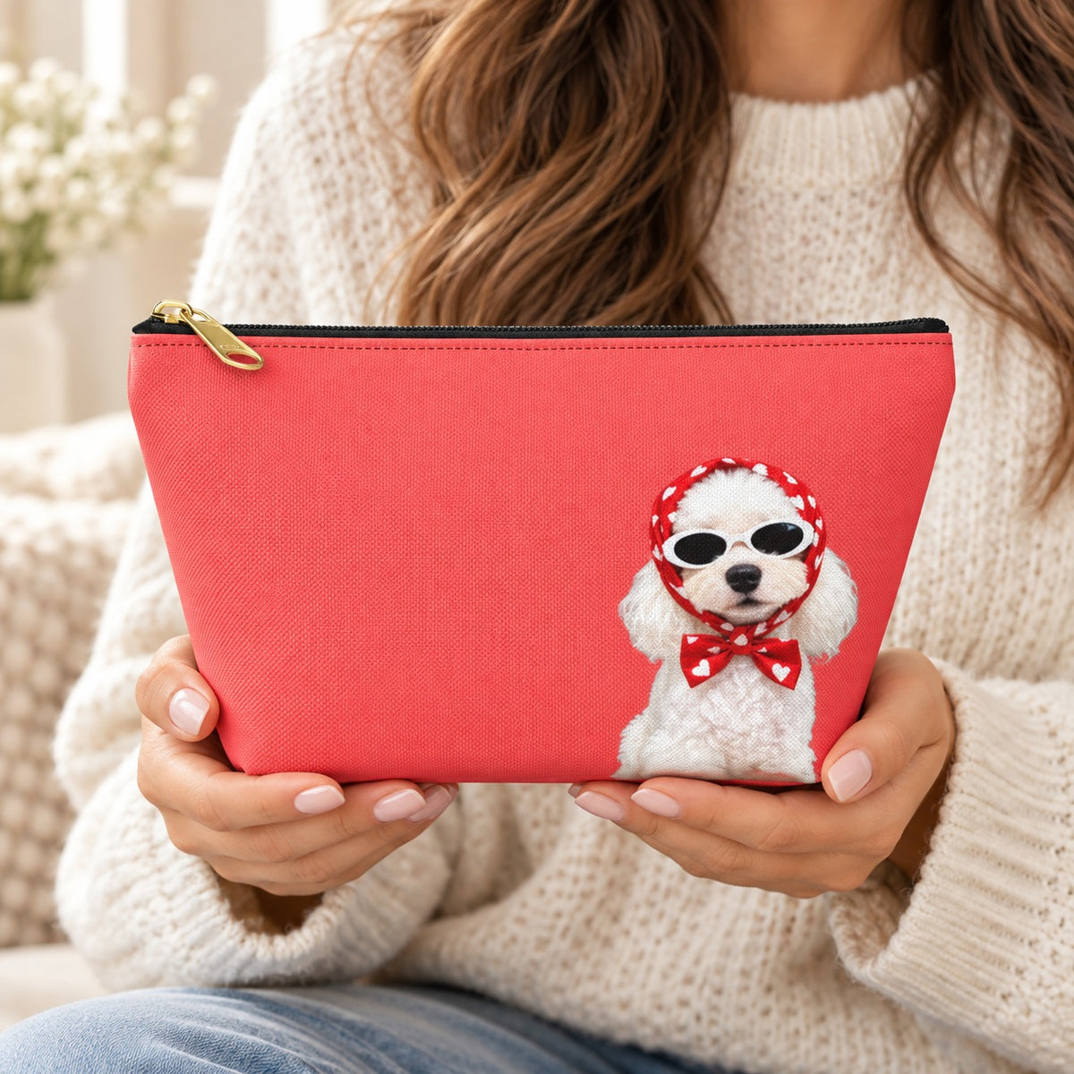 Red makeup pouch with a white Poodle in sunglasses and a red scarf held by a woman
